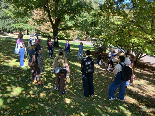 Group of people stand outside